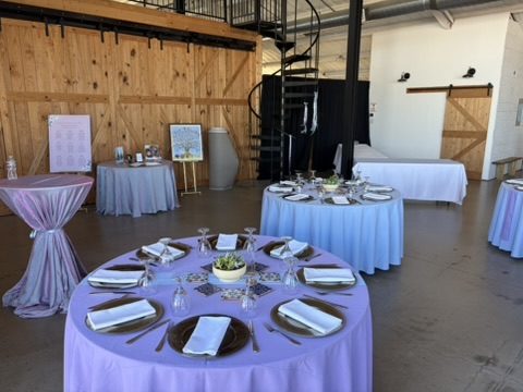 Round table place setting with lavender linens